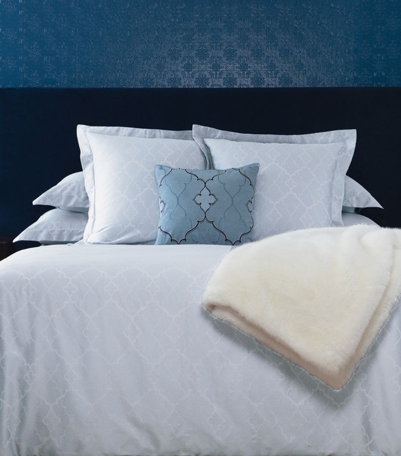 The Yves Delorme Luna duvet cover presents a series of intertwining arabesques to universally meet y