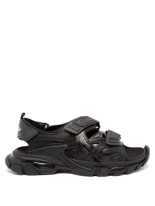 Balenciaga - Balenciaga expands its coveted Track footwear line with these black sandals. They're ma