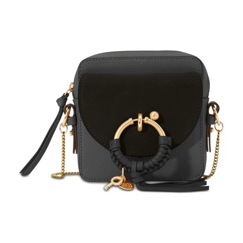 This Joan crossbody bag from See by Chloé is an elegant accessory with folk influences. It combines