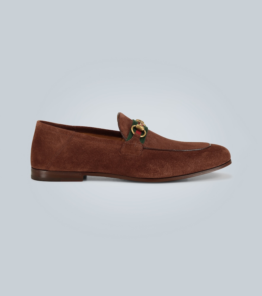 These classic brown suede loafers feature Gucci's iconic horsebit atop the House Web in green and re