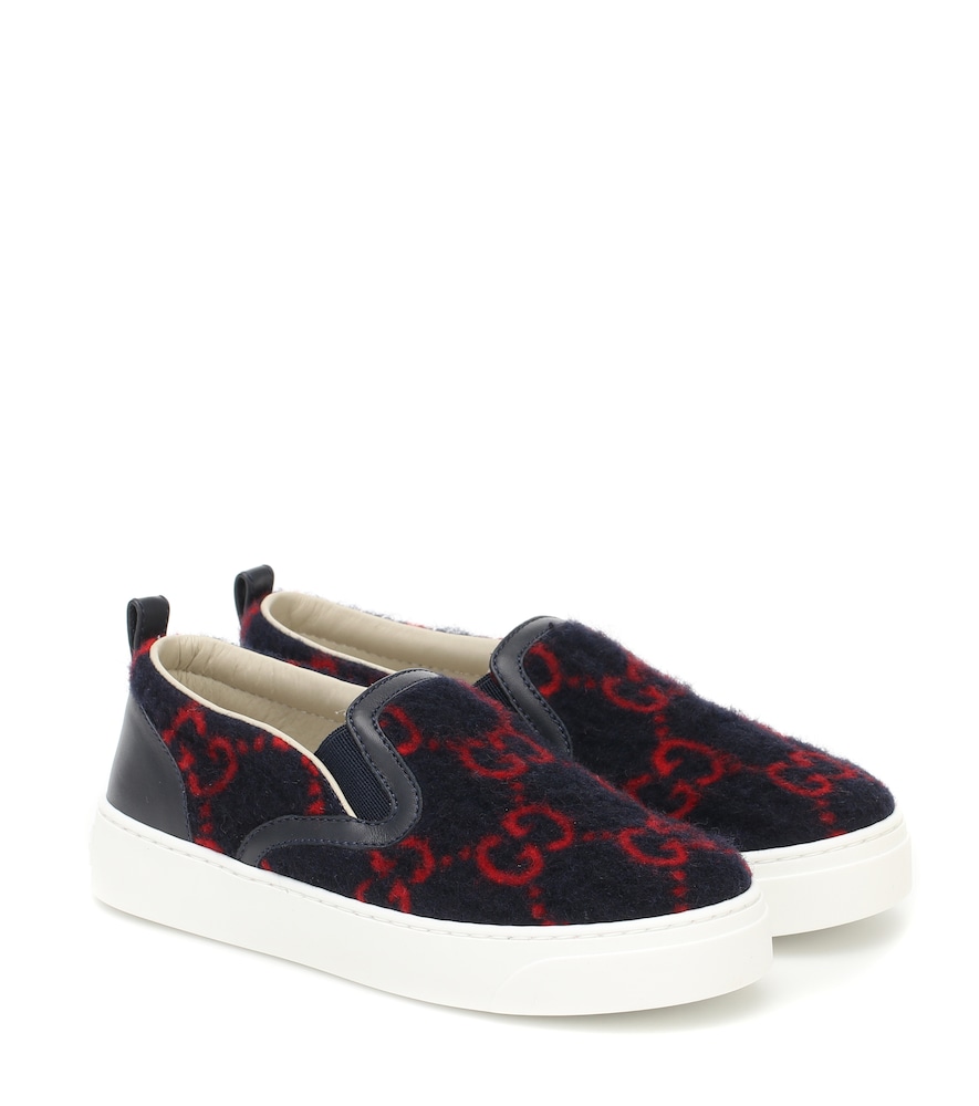 These navy and red sneakers from Gucci Kids are a pint-sized take on one of the label's signature of