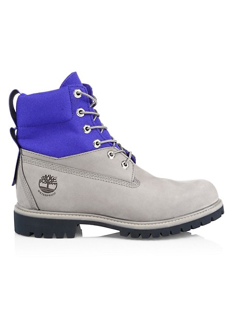 Rugged colorblock field boots feature a mixed-media waterproof design to lock out rain and puddles a