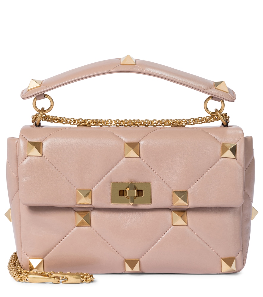 Valentino Garavani updates its iconic hardware on the new Roman Stud Small shoulder bag.