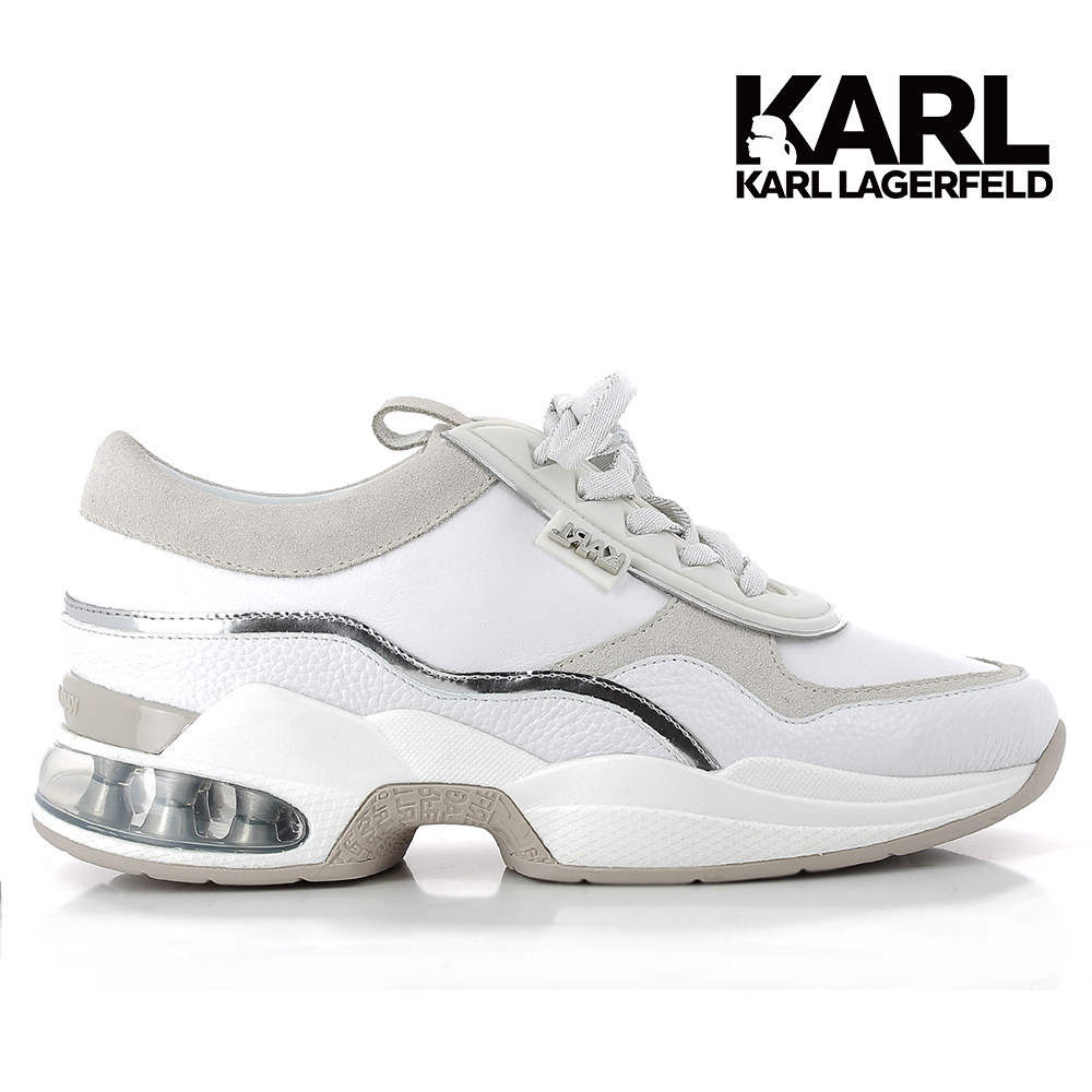 舒適與時尚相遇：這款兩色調皮革跑鞋的運動輪廓突出了閃閃發光的棉質鞋帶，這些鞋帶通過帶有銀色皮革細節的盲孔編織而成。白色的雙密度eva外底和透明的氣泡嵌入確保了極致的舒適度。