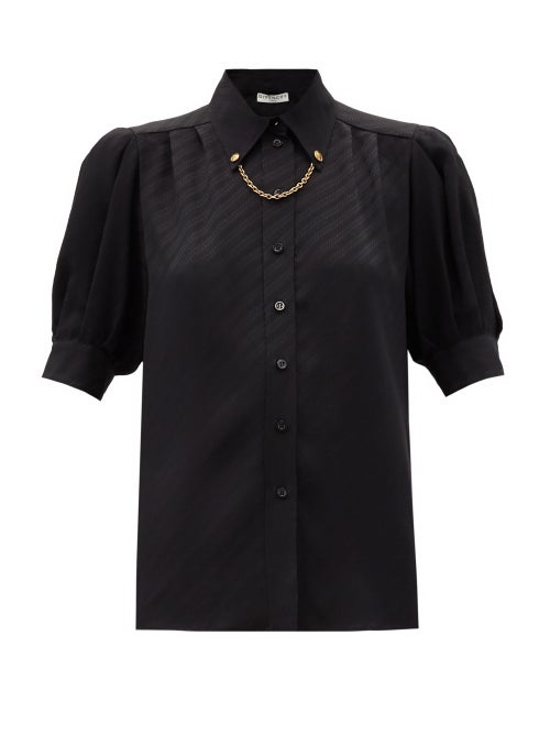 Givenchy - Givenchy's black blouse balances masculine and feminine sensibilities by juxtaposing clea