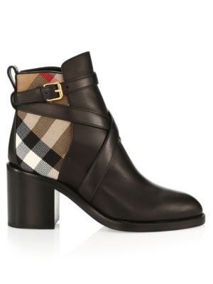 Block-heel ankle boots crafted of rich leather with strappy detailing and canvas signature check ins