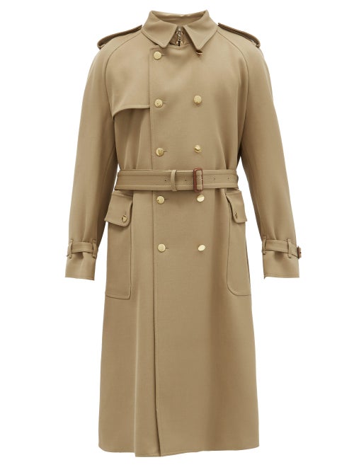 Gucci - Gucci's camel trench coat is accented with a boutique label patch just inside the placket th