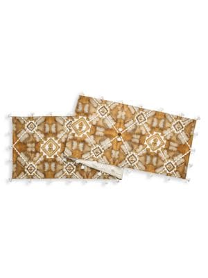 Traditional Bogolan, a hand dyed cotton cloth, is worn in Malian culture as ritual protection and a 