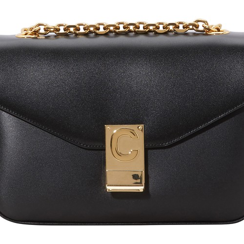 This Medium C bag in calfskin is by Celine. This piece's sliding chain enables you to wear it on the