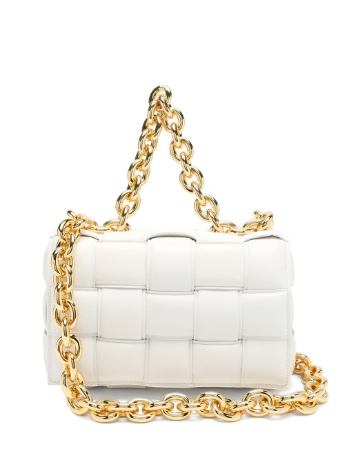 Bottega Veneta - Bottega Veneta creative director Daniel Lee presents a contemporary reimagining of the house's signature Intrecciato weaving technique to create this white The Chain Cassette bag. It's expertly crafted in Italy from supple leather to a boxy profile with a magnetic front flap. Carry it by the chunky gold chain-link shoulder strap for a luxe mood.