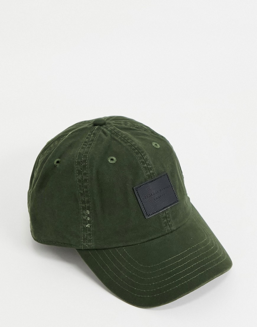 Cap by Criminal Damage Put a lid on it Panelled crown Eyelet vents Curved peak Branded patch to fron