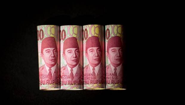 Ilustrasi mata uang Rupiah. Brent Lewin/Bloomberg via Getty Images