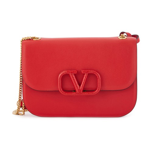 The Valentino Garavani Vlock mini shoulder bag has so many details that appeal to the eye. First and