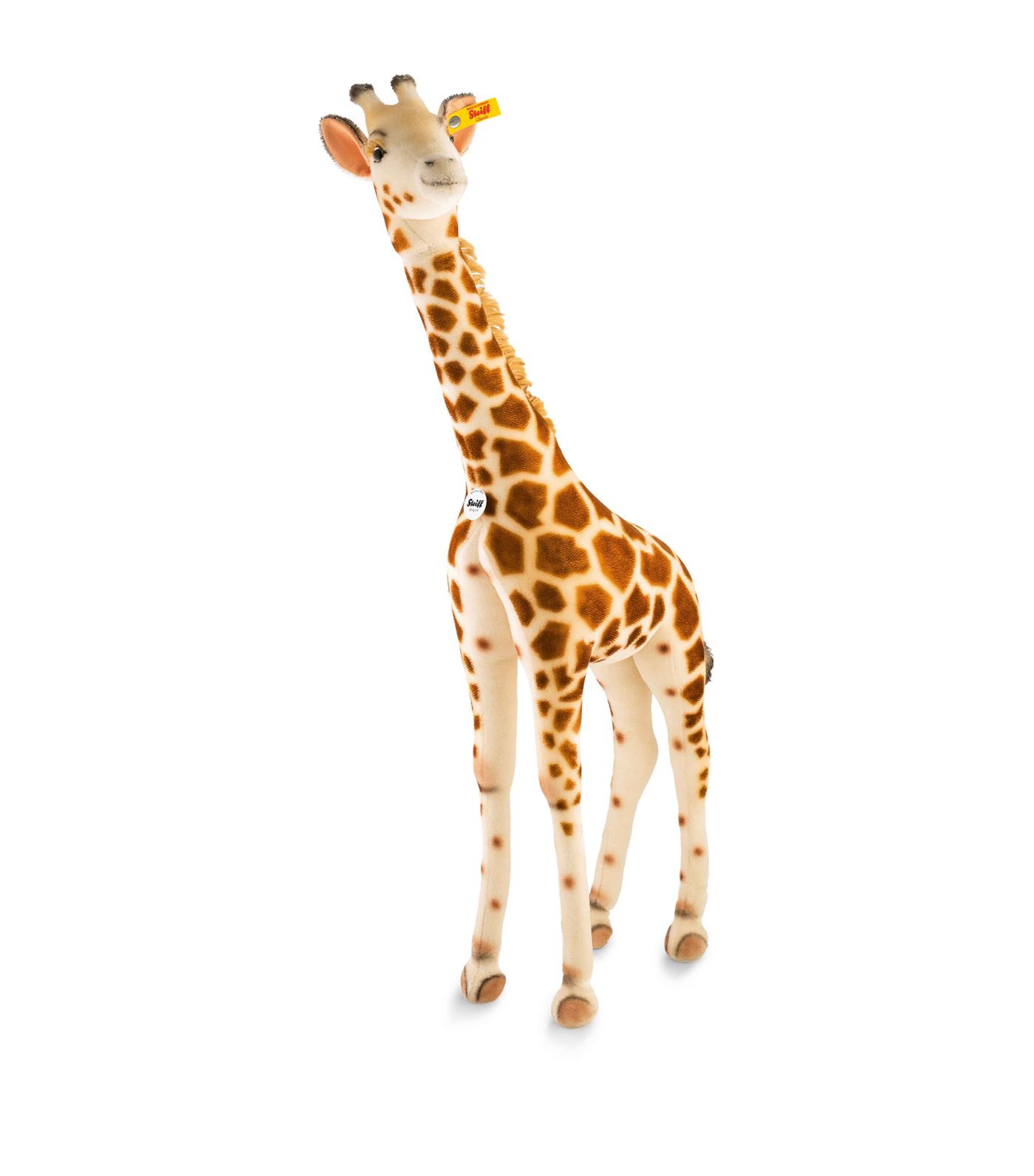 Steiff - Steiff's Studio Giraffe stands tall and proud, crafted in cuddly woven fur with a soft synt