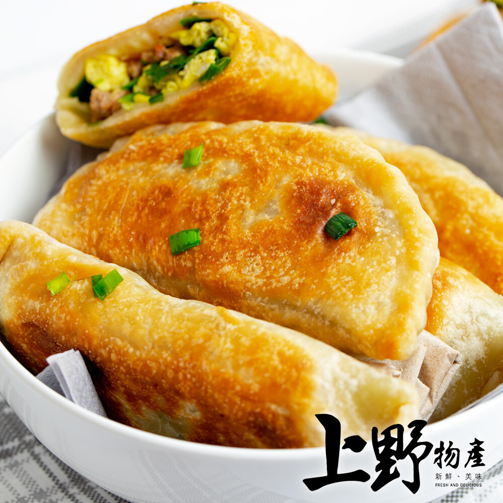 韭菜 豬肉和冬粉交織而成 酥脆麵衣完美包裹餡料 湯汁四溢 香氣十足 1.商品組合/規格上野物產山東老鄉的韭菜盒子(1125g10%/25粒/包) 2.商品品名台灣傳統香酥韭菜盒子 3.商品重(容)量1