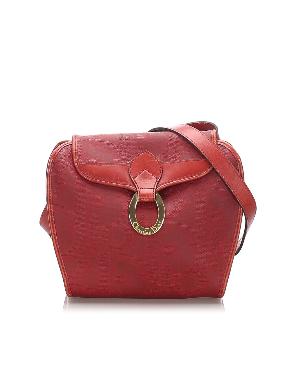 This crossbody bag features a PVC body with leather trim, a flat leather strap, a front flap with a