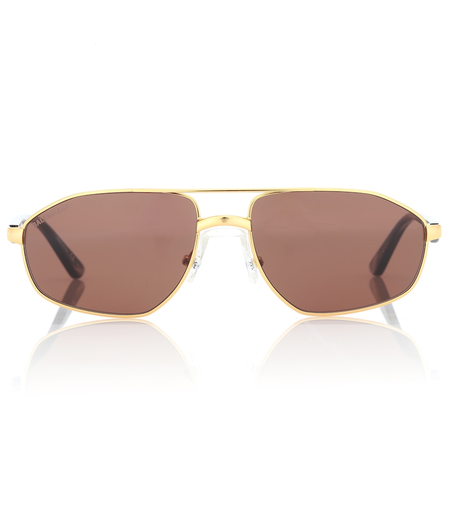 Thin, golden frames and black lenses define these rectangular sunglasses from Balenciaga.