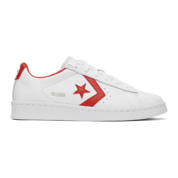 Low-top buffed leather sneakers in white. Round toe. Tonal lace-up closure. Textile logo patch in wh