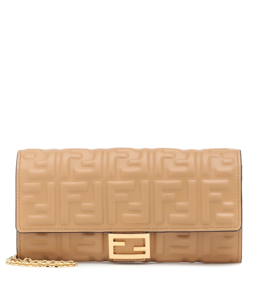 The Baguette leather wallet from Fendi makes a sleek impression with its FF-embossed beige leather.