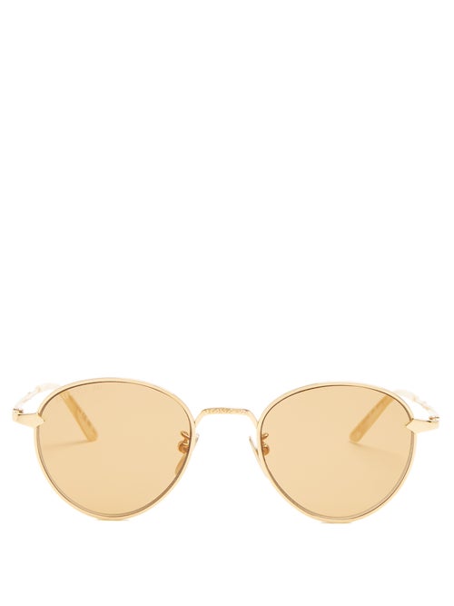 Gucci - Gucci's round-frame sunglasses are made from engraved gold-tone metal, set with yellow-tinte