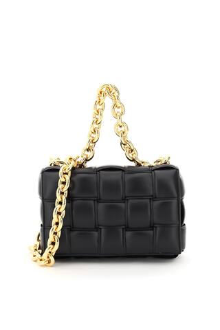 The Chain Cassette bag by Bottega veneta, enhanced by a woven construction made from tone-on-tone double-faced padded leather straps. Maxi chain top handle and shoulder strap, front flap with snap closure, unlined interior with one zip pocket. Gold-tone metalware.