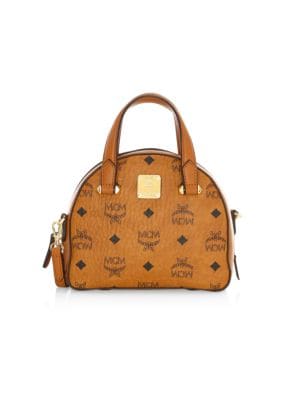 Original coated canvas construction accented with luxe hardware elevates this miniature tote.; Top z