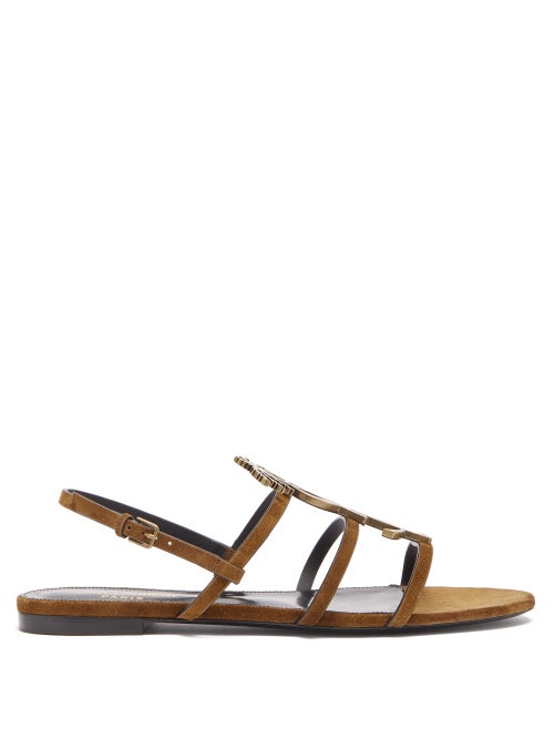 Saint Laurent - Saint Laurent's brown Cassandra sandals display the label's iconic YSL logo plaque, 