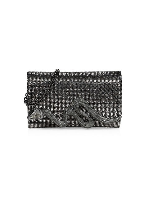 Encrusted with dazzling crystals and adorned with a serpent, this convertible clutch makes a powerfu