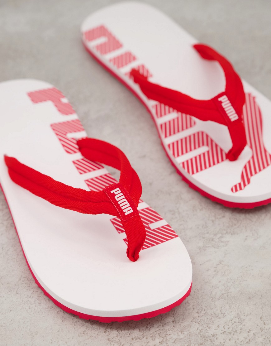 Flip flops by PUMA Free your feet V-shaped straps Toe post Branded footbed Flat rubber sole Textured