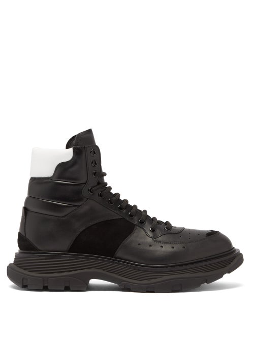 Alexander McQueen - Alexander McQueen's black panelled boots sit on the signature chunky sole which 