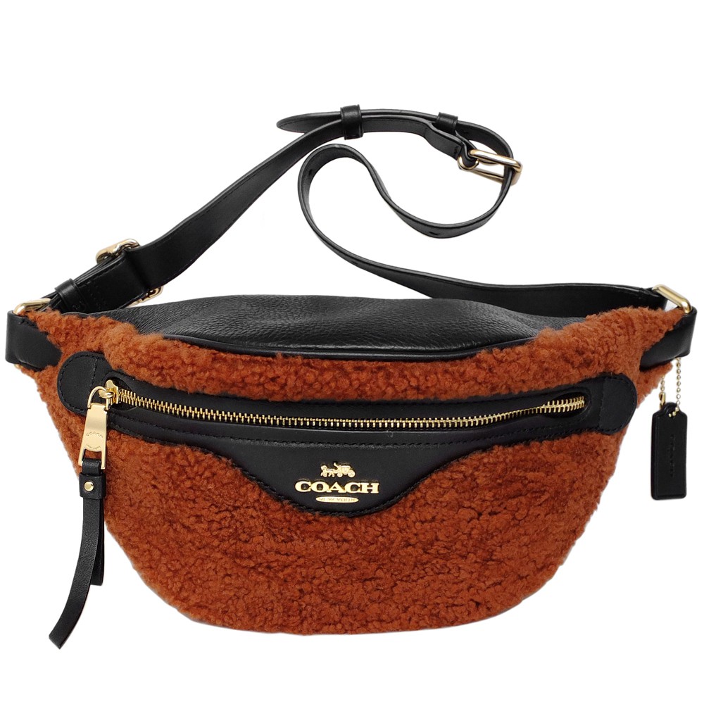 品牌：COACH 尺寸：上寬34CM/拉鍊開口寬23CM、高14CM，背帶可10段式調整/最長71CM 顏色：紅棕色毛呢/黑色真皮及布面內裡商品來源：美國，平行輸入 全新真品 越南製空間容量：ipho