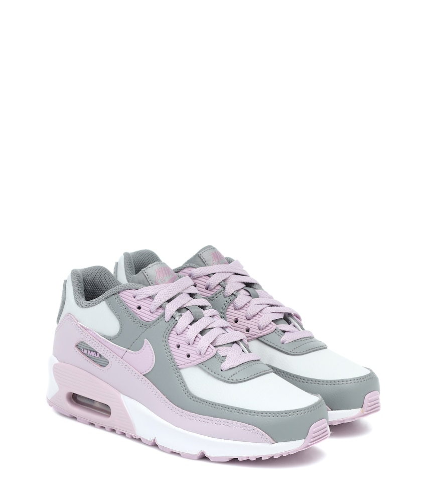 Tiny toes will love this petite pair of Air Max 90 sneakers from Nike Kids.