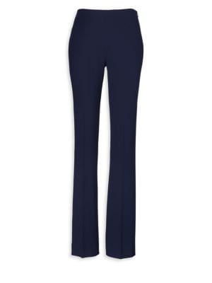 From the Iconic Collection; Modern slim-fit wool pant with timeless tailoring; Concealed side zip wi
