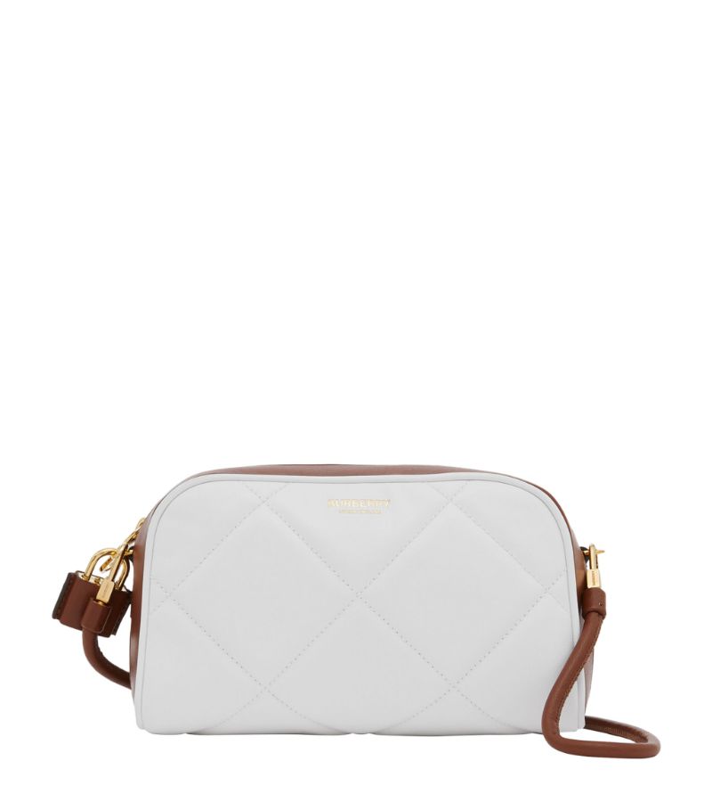 The Burberry Half Cube shoulder bag is a compact take on the labels bestselling bowling bag, rendere