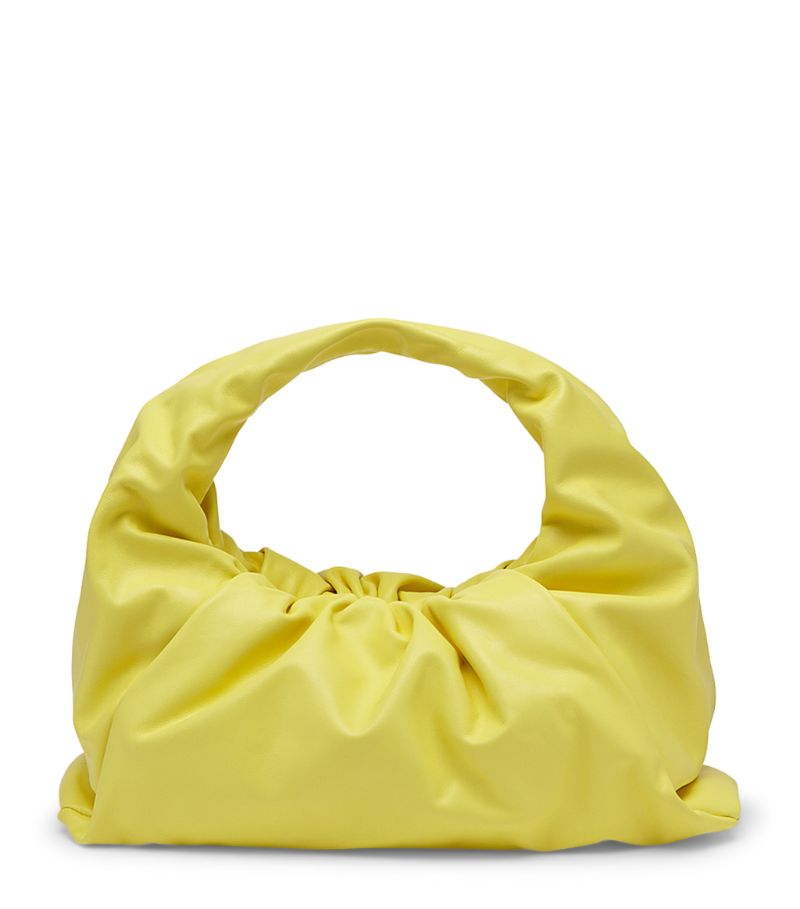 With the Shoulder Pouch bag, Bottega Veneta redefines luxury for the new season. Where you might expect structure and rigidity, you'll instead find a fluid, free-form silhouette that subverts convention to offer a truly unique addition to your accessories repertoire. The cloud-like profile is rendered in supple nappa leather as testament to the brand's exquisite craftsmanship, enhancing the design with its subtle sheen.