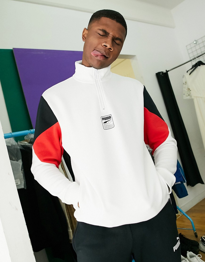 Sweatshirt by PUMA Comfy, meet cool Colour-block design High neck Half zip fastening PUMA logo print
