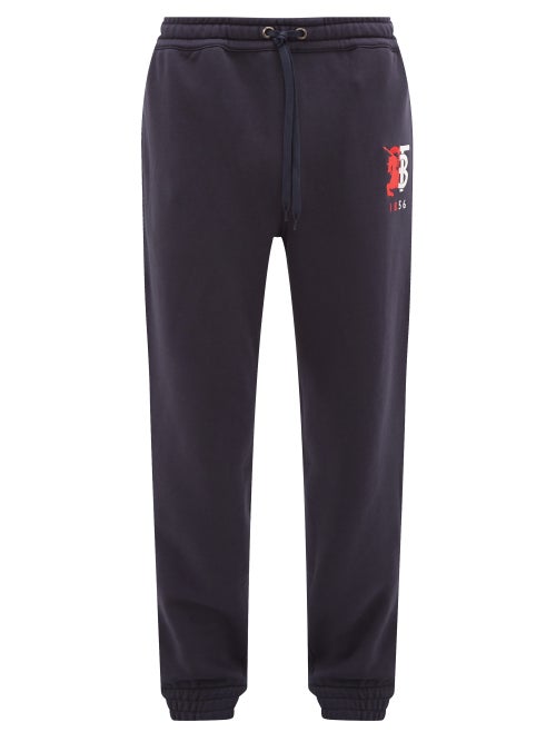 Burberry - The red and white hybrid logo embroidery on these navy Marshall track pants represents th