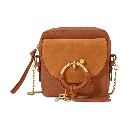 This Joan crossbody bag from See by Chloé is an elegant accessory with folk influences. It combines