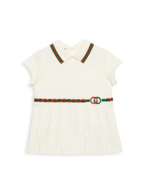 Ivory stretch cotton piquet; Spread collar; Short sleeves; Back button close; Green and red Web trim