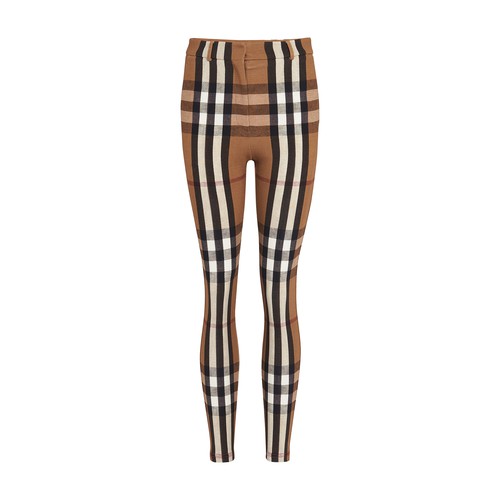 Burberry reinvents straight pants by covering them with its famous tartan pattern. Its refined high-