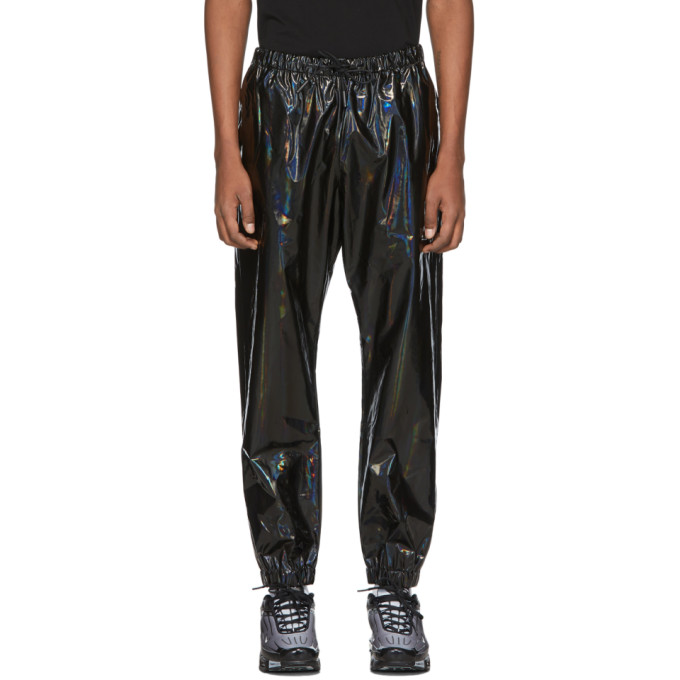Tapered iridescent polyurethane lounge pants in black. Mid-rise. Three-pocket styling. Drawstring at