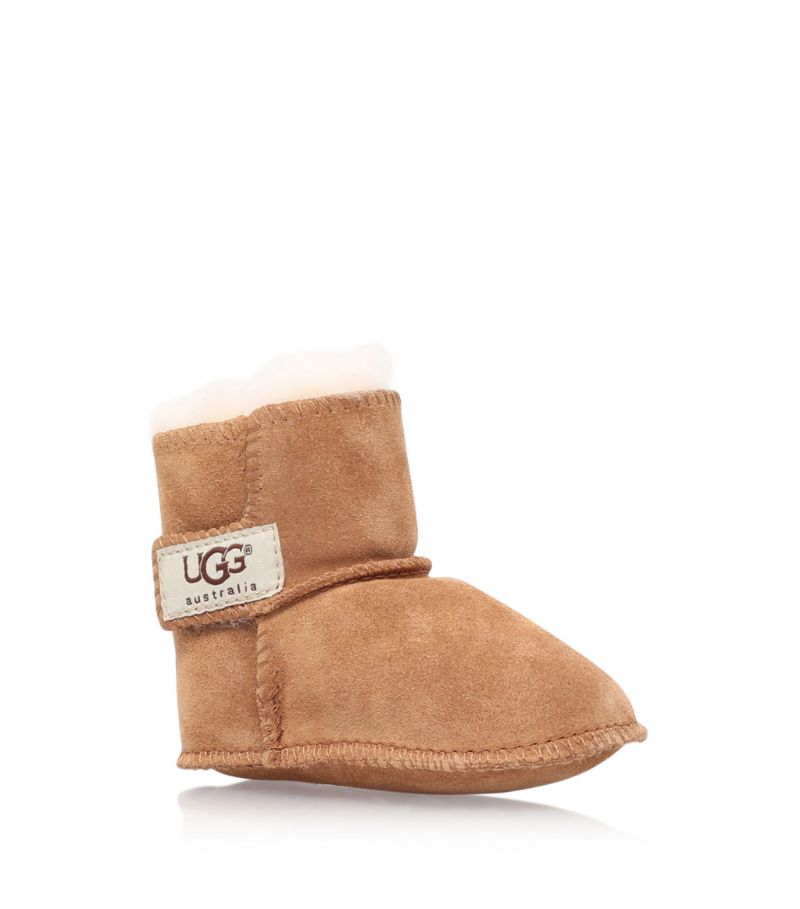 A pair of crib shoes crafted in gentle suede, the Erin booties by UGG are a warm style for little fe