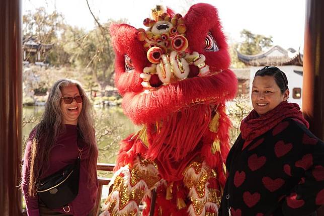 People attend a Chinese New Year festival at the Huntington Library, Art Museum and Botanical Gardens in Southern California, the United States, Feb. 10, 2024. (Photo by Zeng Hui/Xinhua)