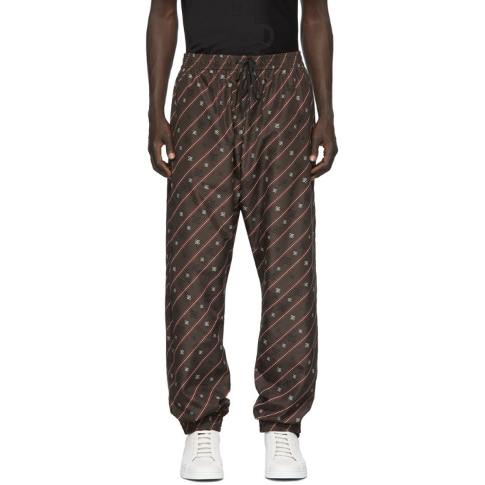 Relaxed-fit technical satin lounge pants in brown featuring logo pattern printed in black and white 