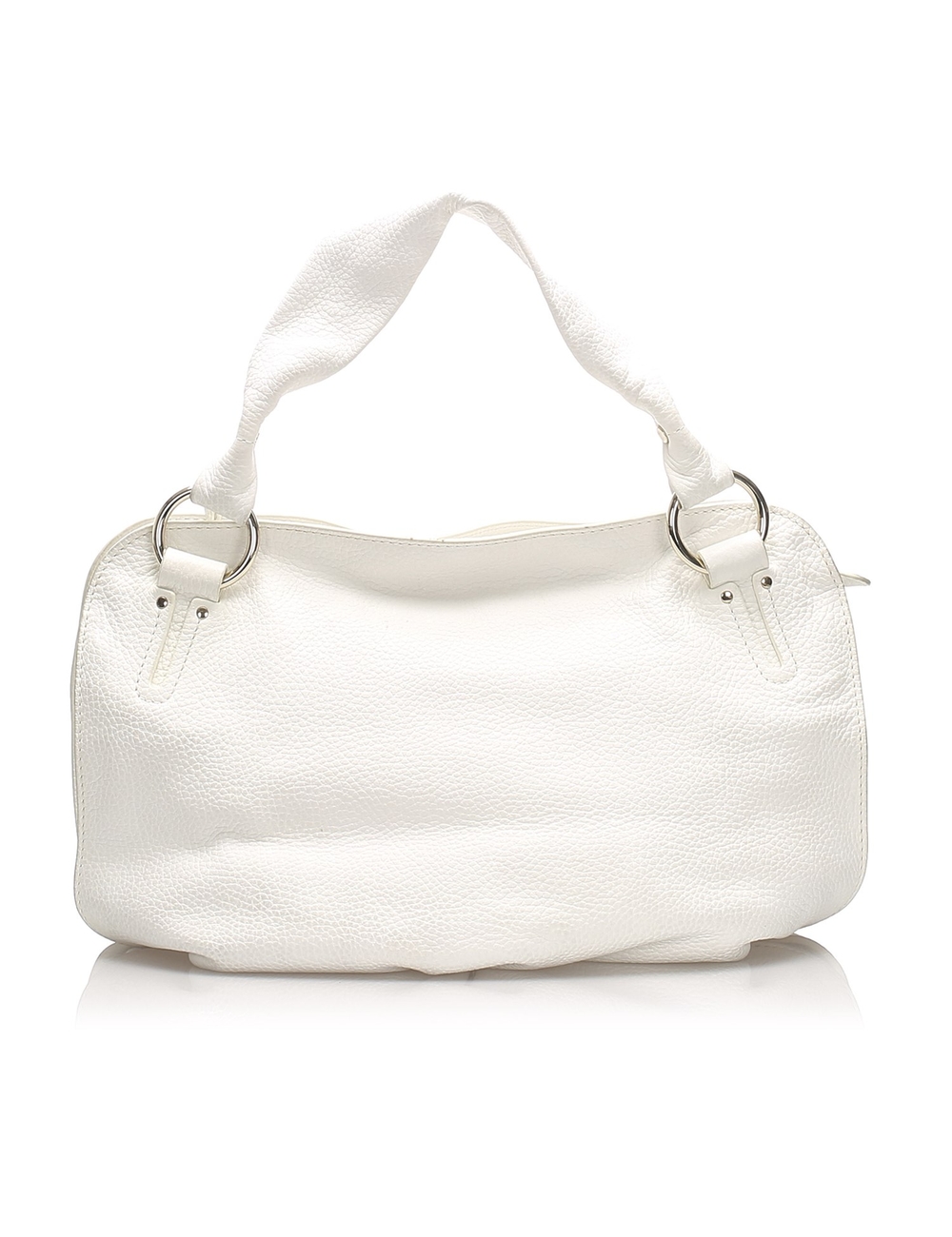 The Bittersweet features a leather body, flat straps, a top zip closure, and an interior pocket. Mea