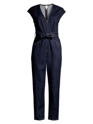 Exposed stitching lends a deconstructed aesthetic to this denim jumpsuit.; V-neck; Cap sleeves; Conc