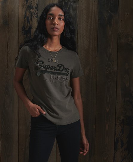 Shine your way to a stylish wardrobe this season with the Vintage Logo Sequin Tee. Slim fit - design