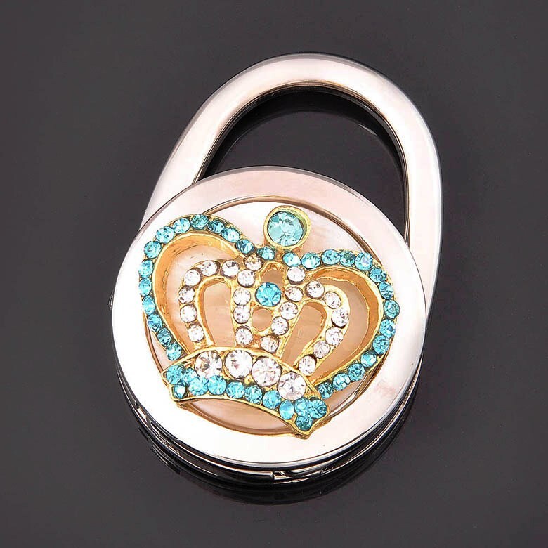 ★親愛顧客，請在下單前詳閱購物須知★ 商品介紹 :都市簡約風潮,當您外出聚餐的時候,是否還在擔心包包該放在哪裡,使用掛包器,將包包掛在您視線可及的桌緣,您在不需要使用掛包器時,還可當包包的配飾,可當掛