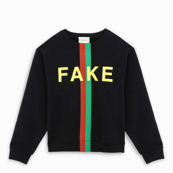 Crewneck sweatshirt by Gucci in black fleece cotton jersey, featuring washed effect, Fake/ Not print
