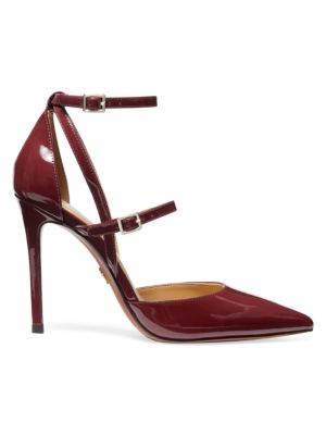 In a classic d'Orsay silhouette, these patent leather pumps have slim straps wrapping around the foo